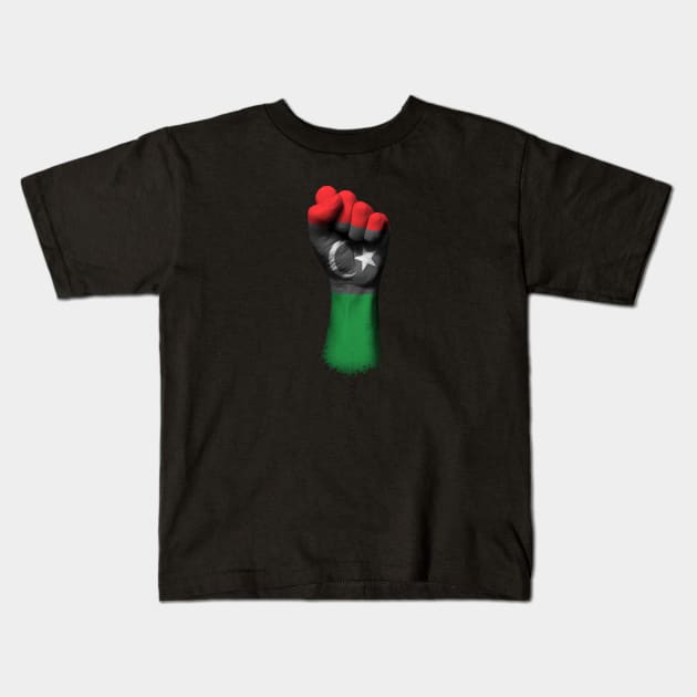 Flag of Libya on a Raised Clenched Fist Kids T-Shirt by jeffbartels